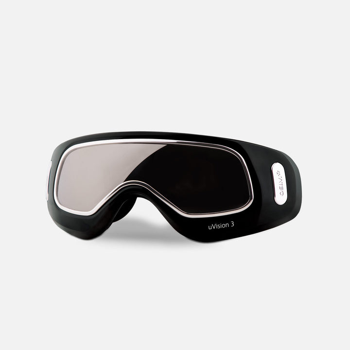 Black sleek eye massager device with reflective lens and contour design, labeled uDivineV Eye Massager for advanced eye therapy.